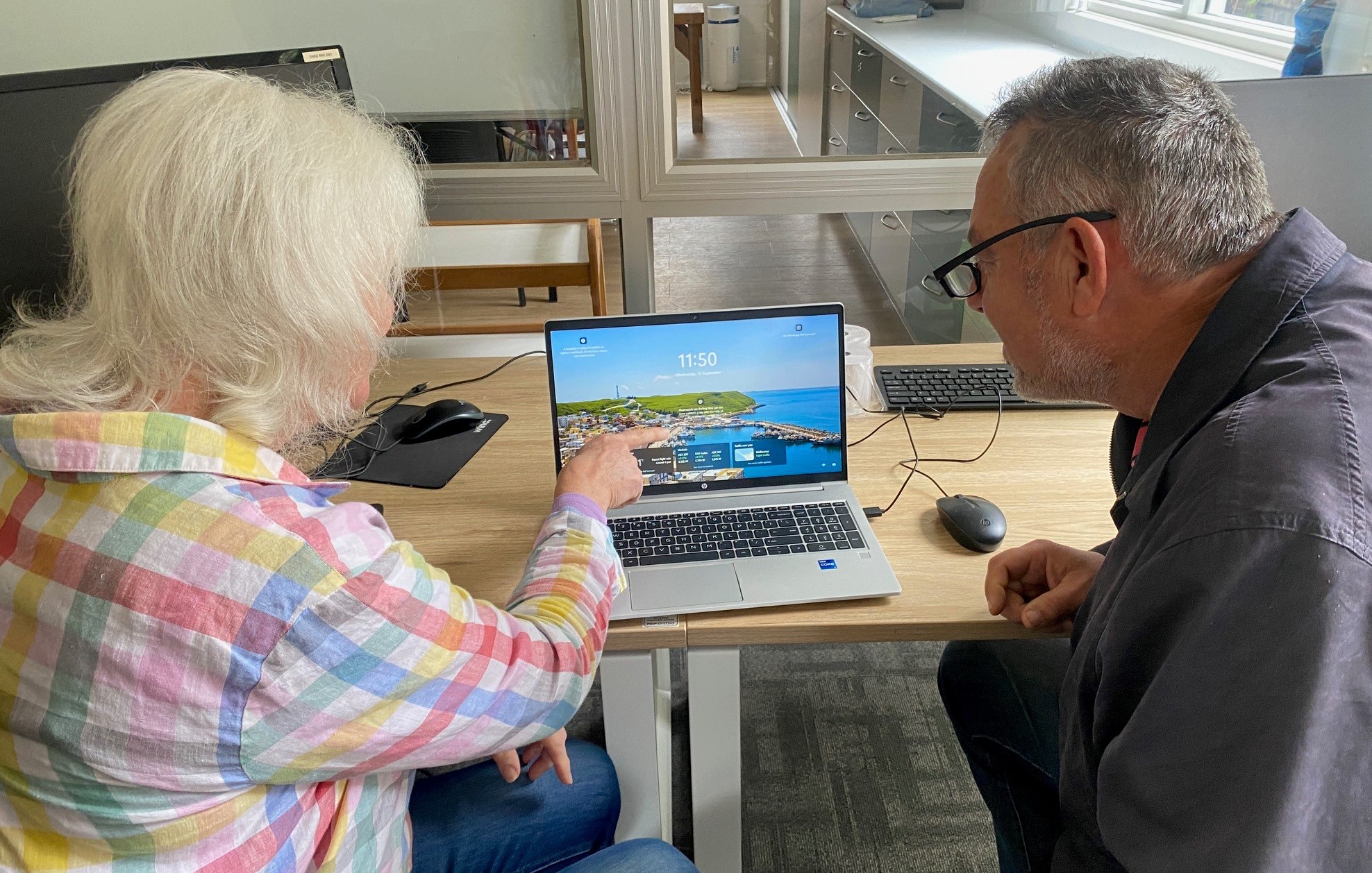 Nola and Con at computer